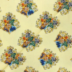 Tissu coton Harry Potter Blason de Poudlard - jaune